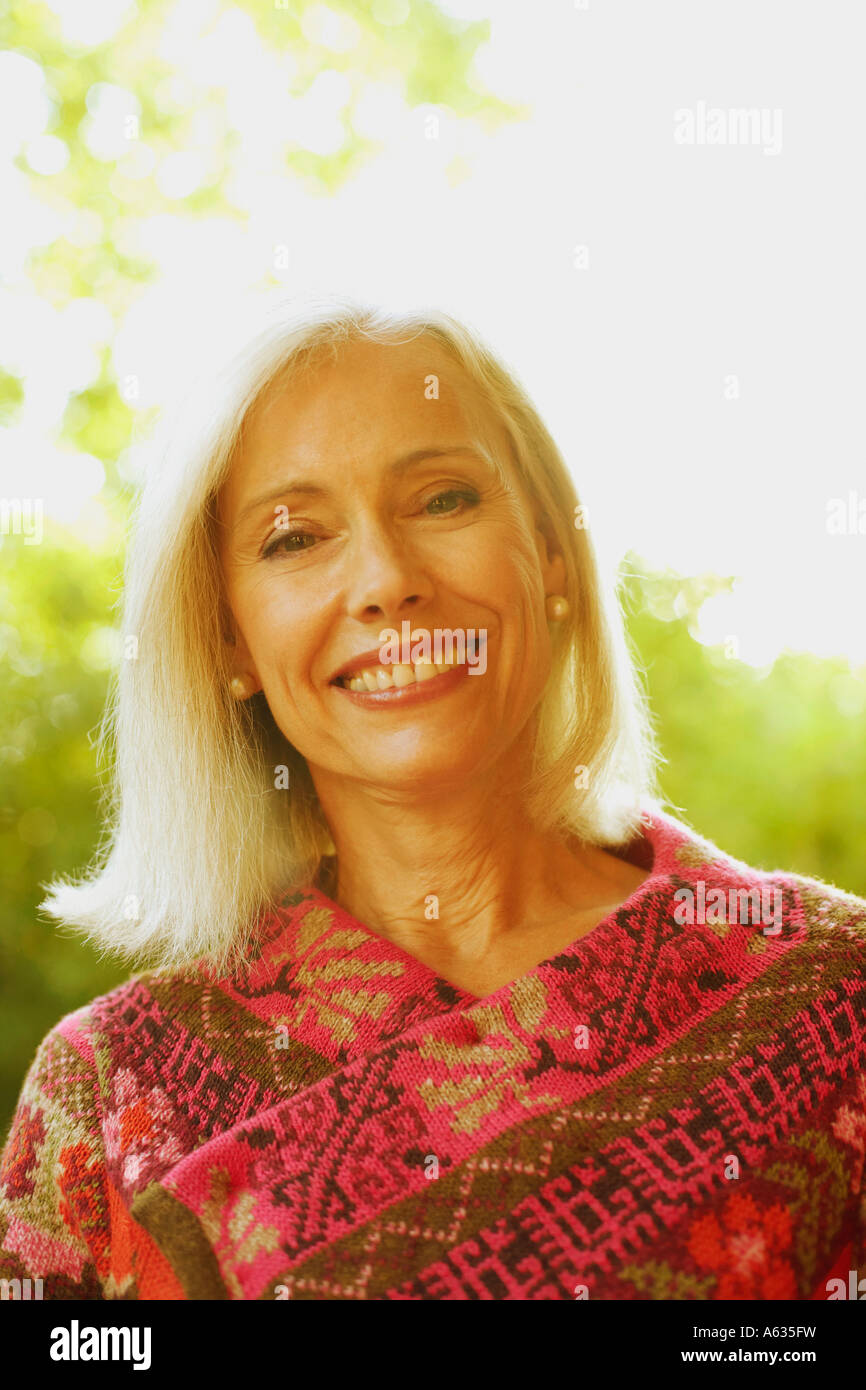 Portrait of a senior woman smiling Stock Photo - Alamy
