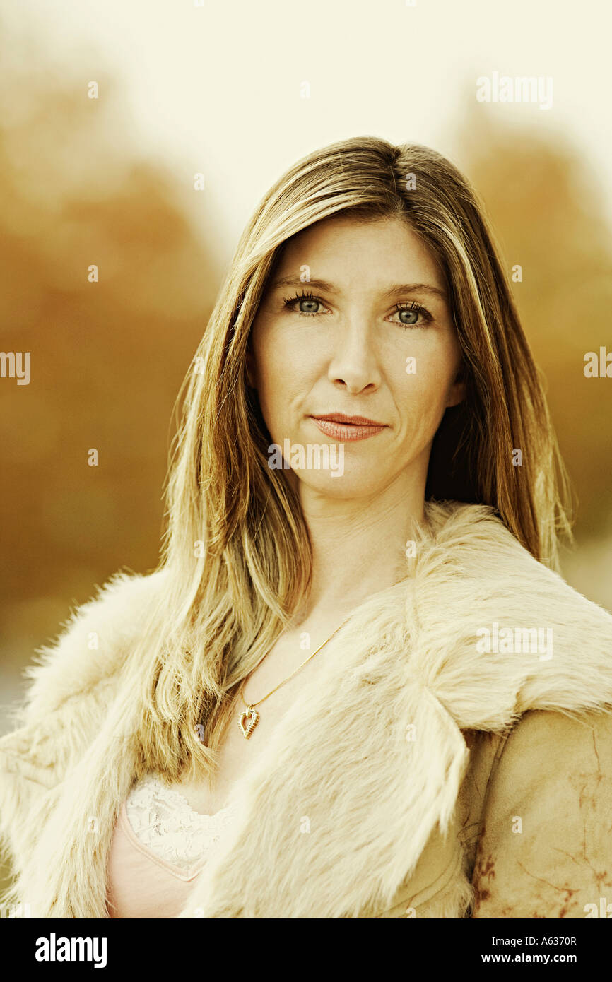 Portrait of a mature woman wearing fur coat Stock Photo