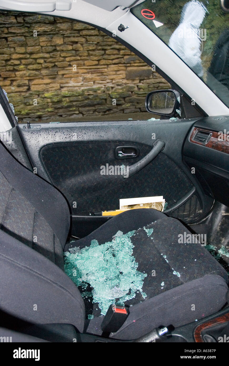 Car which has had a window broken and radio stolen Stock Photo Alamy