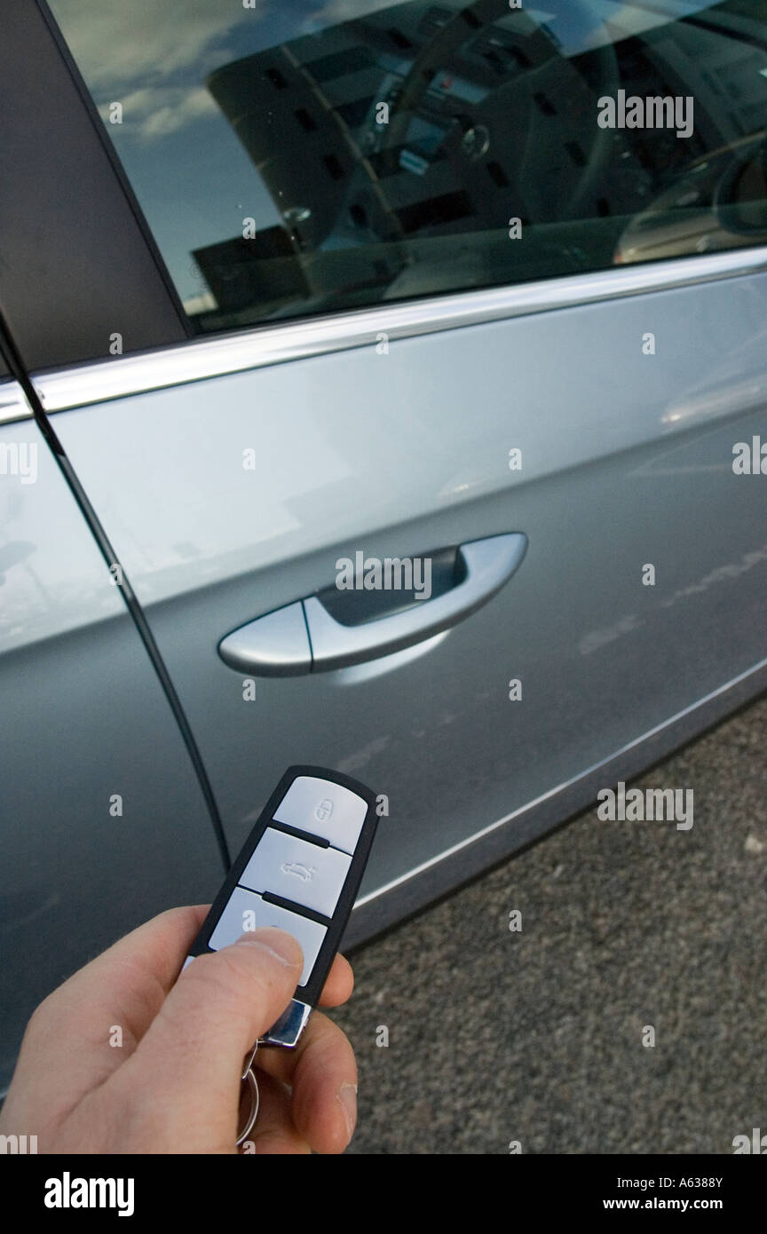 Mans hand holding the electronic key fob of a new car Stock Photo