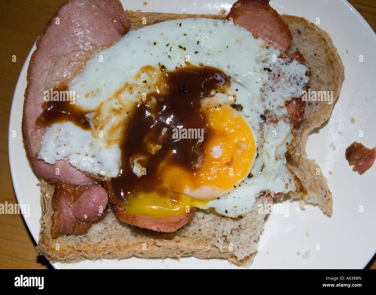 A bacon egg and brown sauce sandwich Stock Photo Alamy