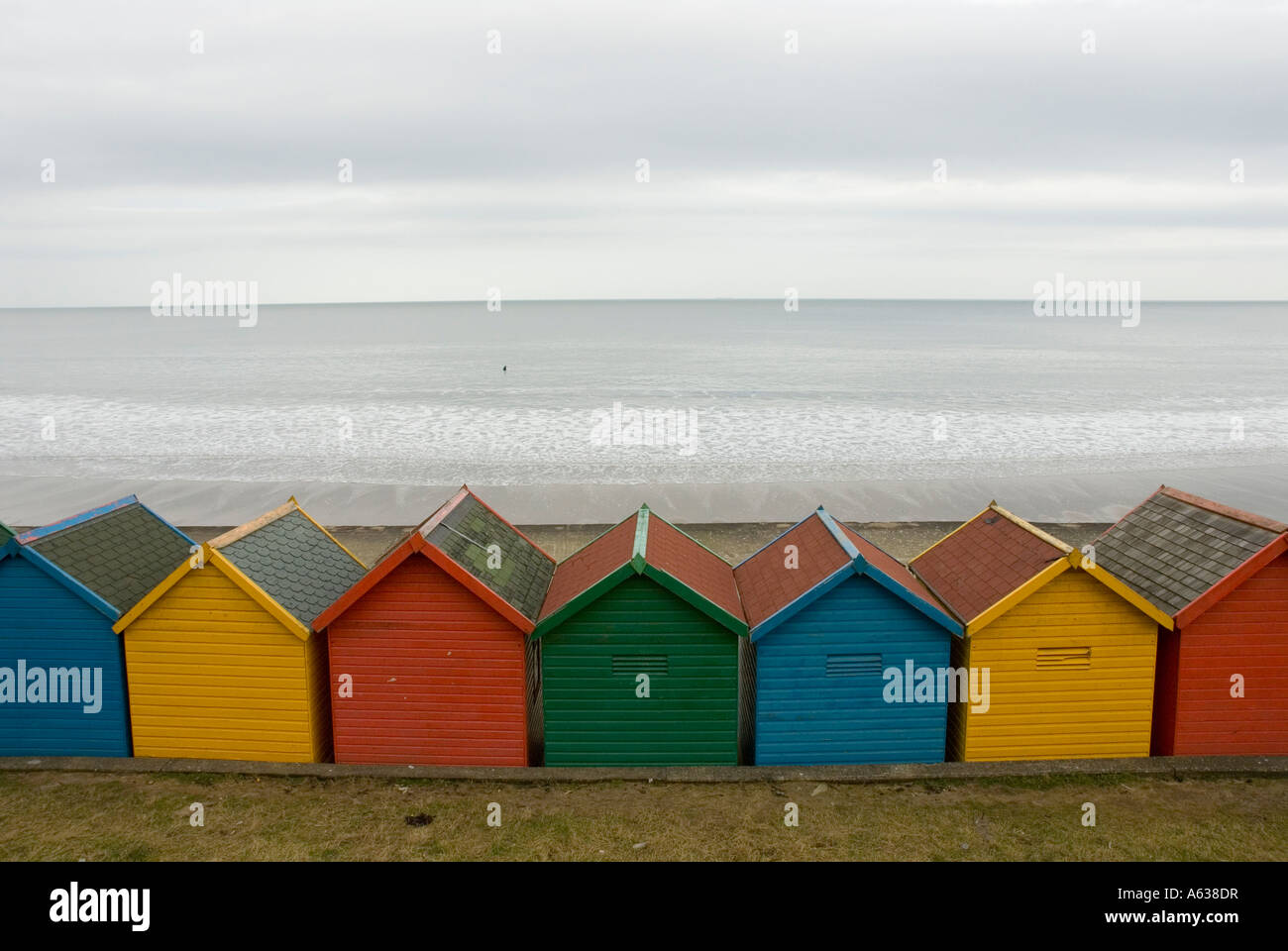 Coloured beach huts at Whitby North Yorkshire on an overcast day Stock Photo