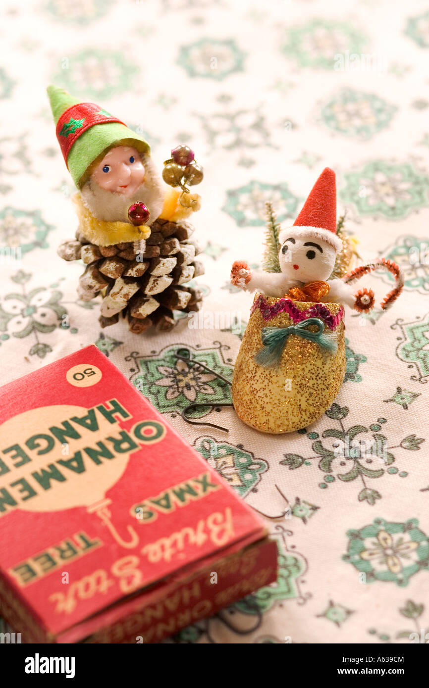 Nostalgic Christmas ornaments on snowflake fabric, with caption space at the top. Stock Photo