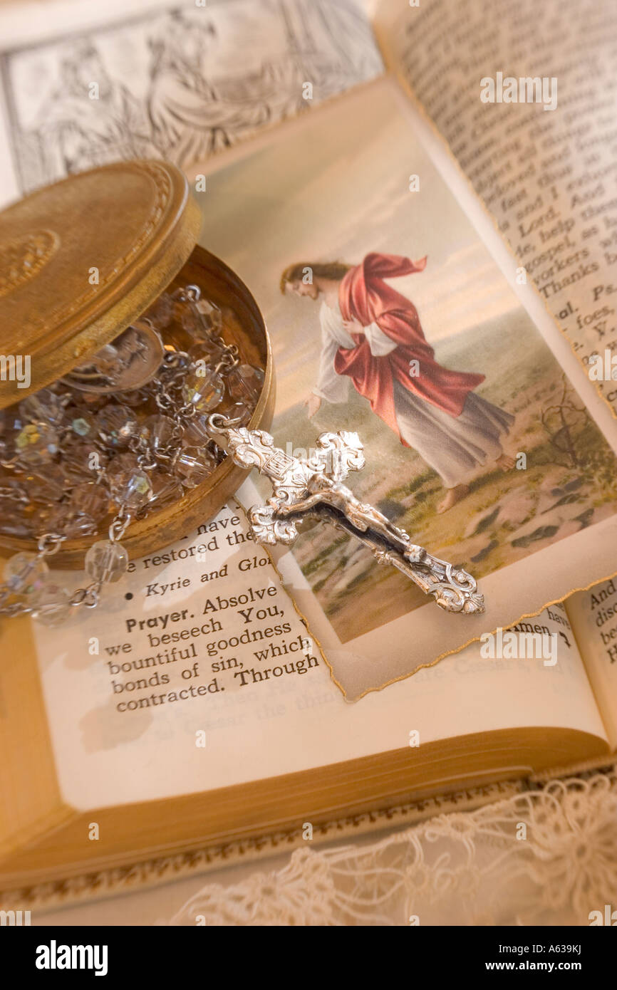 Catholic Missal with crystal rosary and holy card of Christ Stock Photo