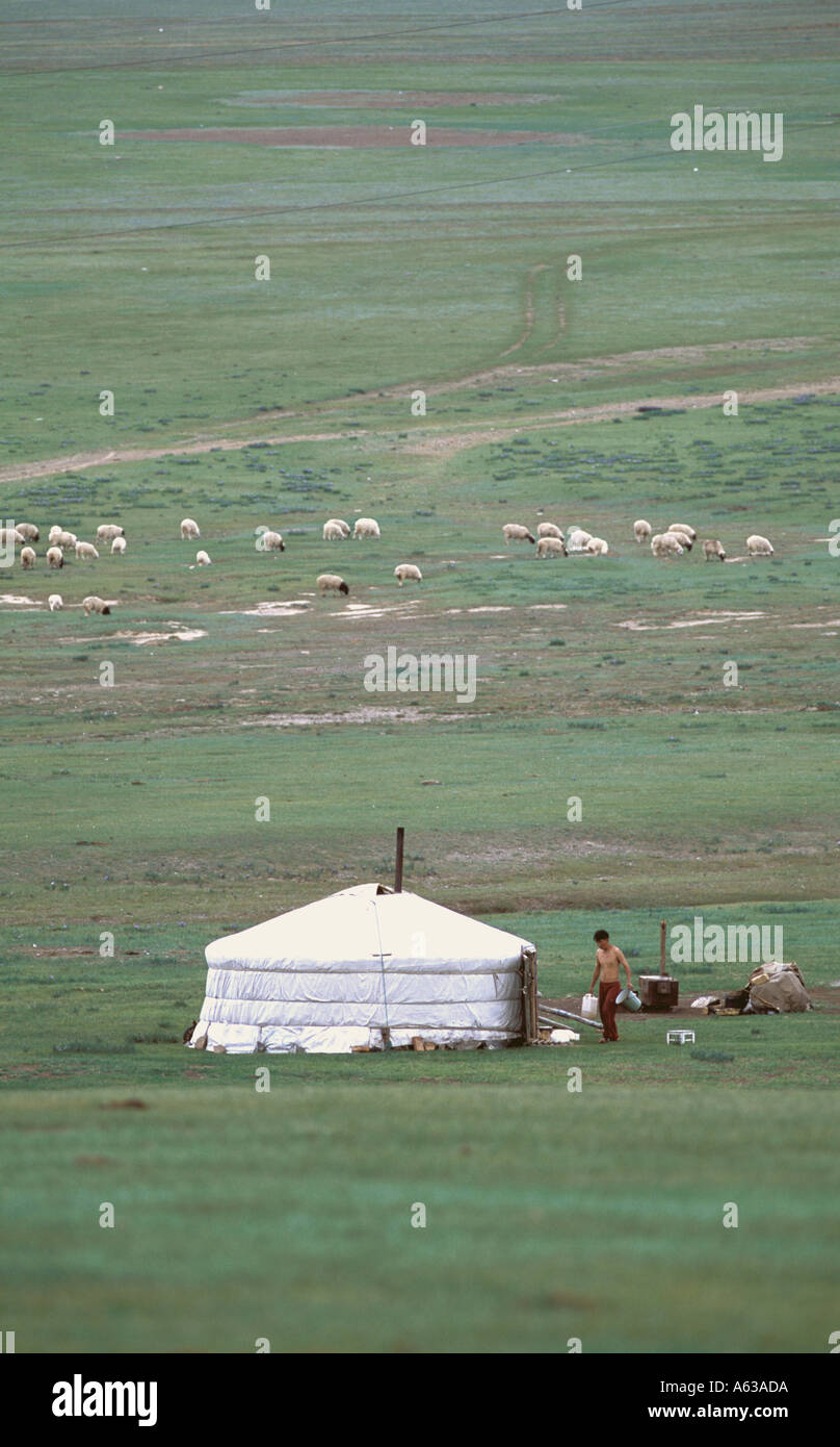 A Mongolian nomad and his ger on the steppe in Central Asia Stock Photo ...