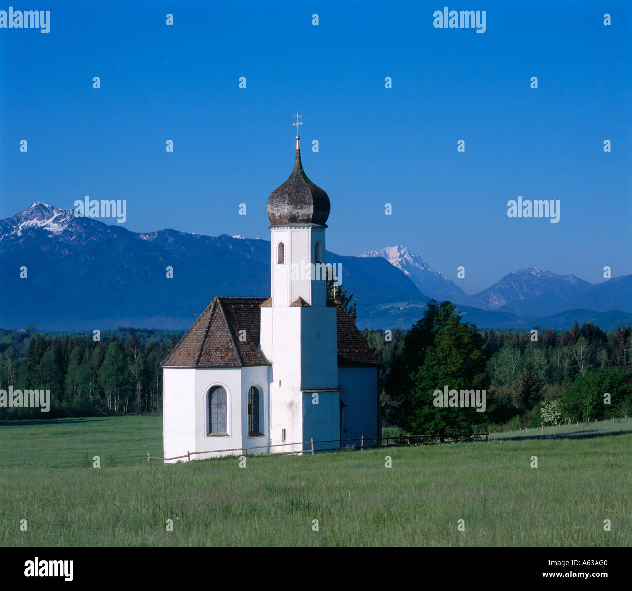 Chapel with mountain in background, Penzberg, Weilheim-Schongau, Bavaria, Germany Stock Photo