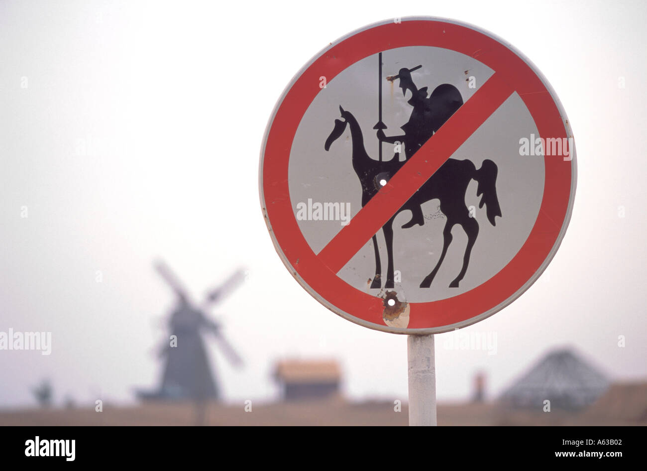 A sign humorously forbids would-be Don Quixotes tilting at a nearby windmill outside Minsk Belarus Stock Photo