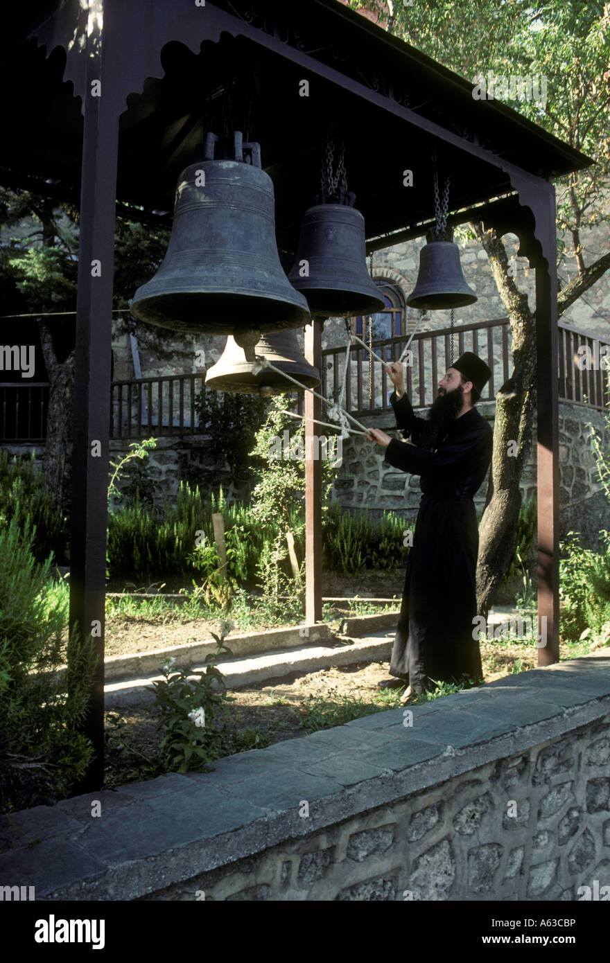 Greek monk ringing bells, Greek monk, ringing bells, Holy Monastery of