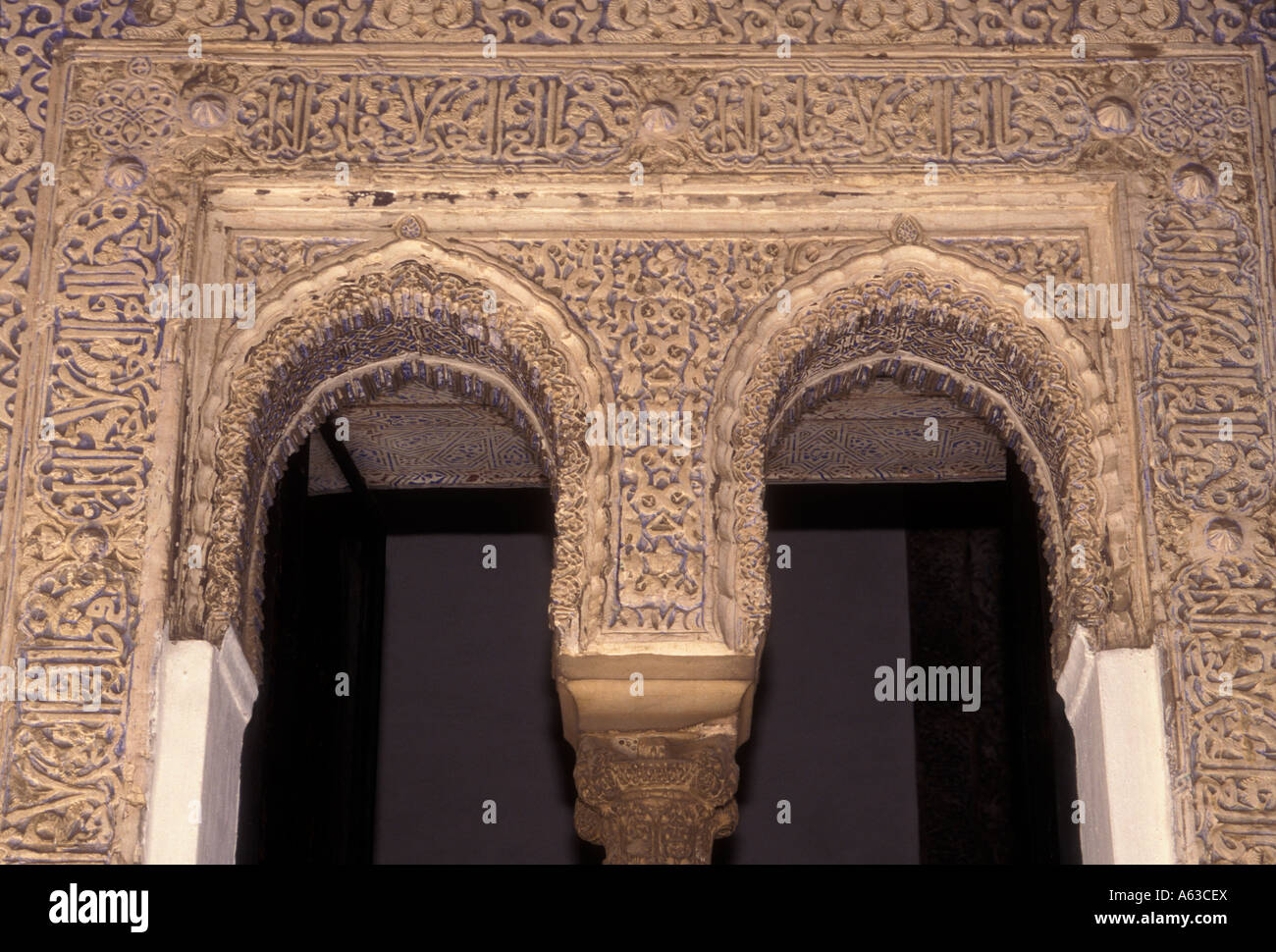 Arch arches arcade tiling facade in courtyard at El Alcazar Seville ...