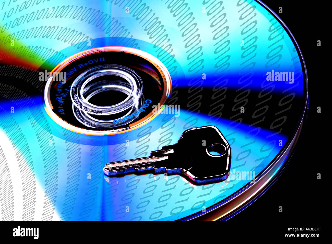Concept data security, single DVD with key isolated on black baclground Stock Photo