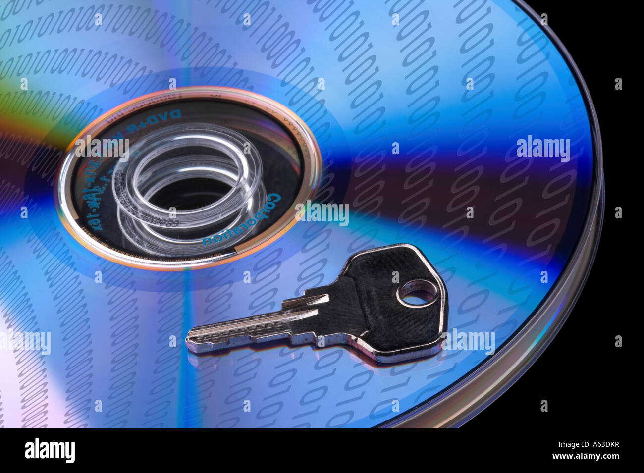 Concept data security, single DVD with key isolated on black baclground Stock Photo