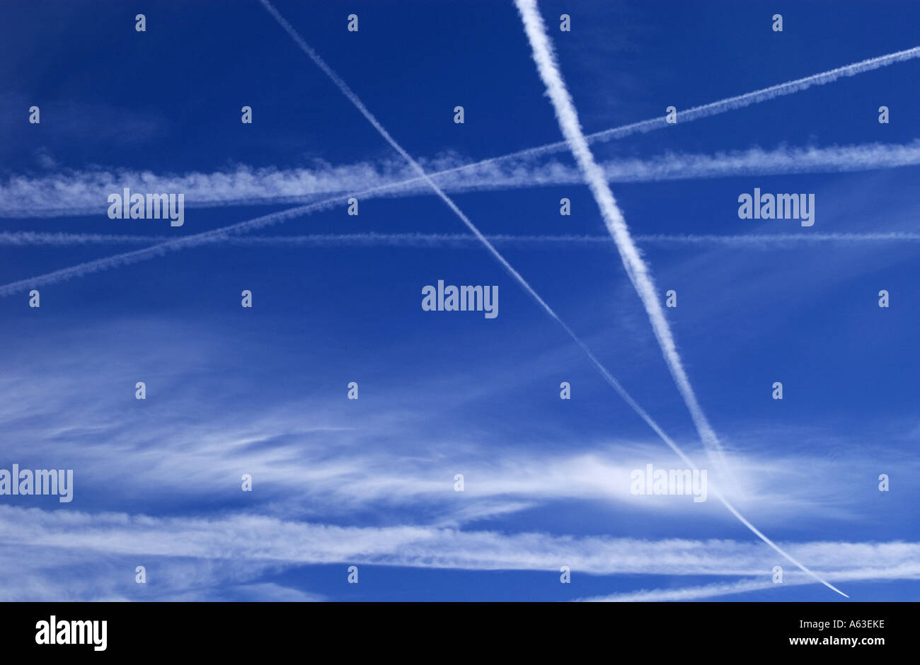 Plane vapour trails across the sky Stock Photo