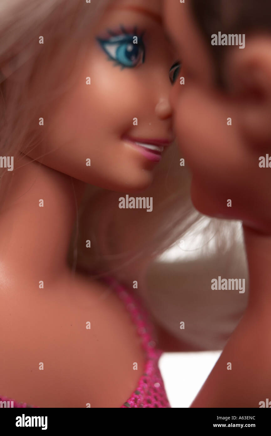 Close-up of doll flirting with toy man Stock Photo