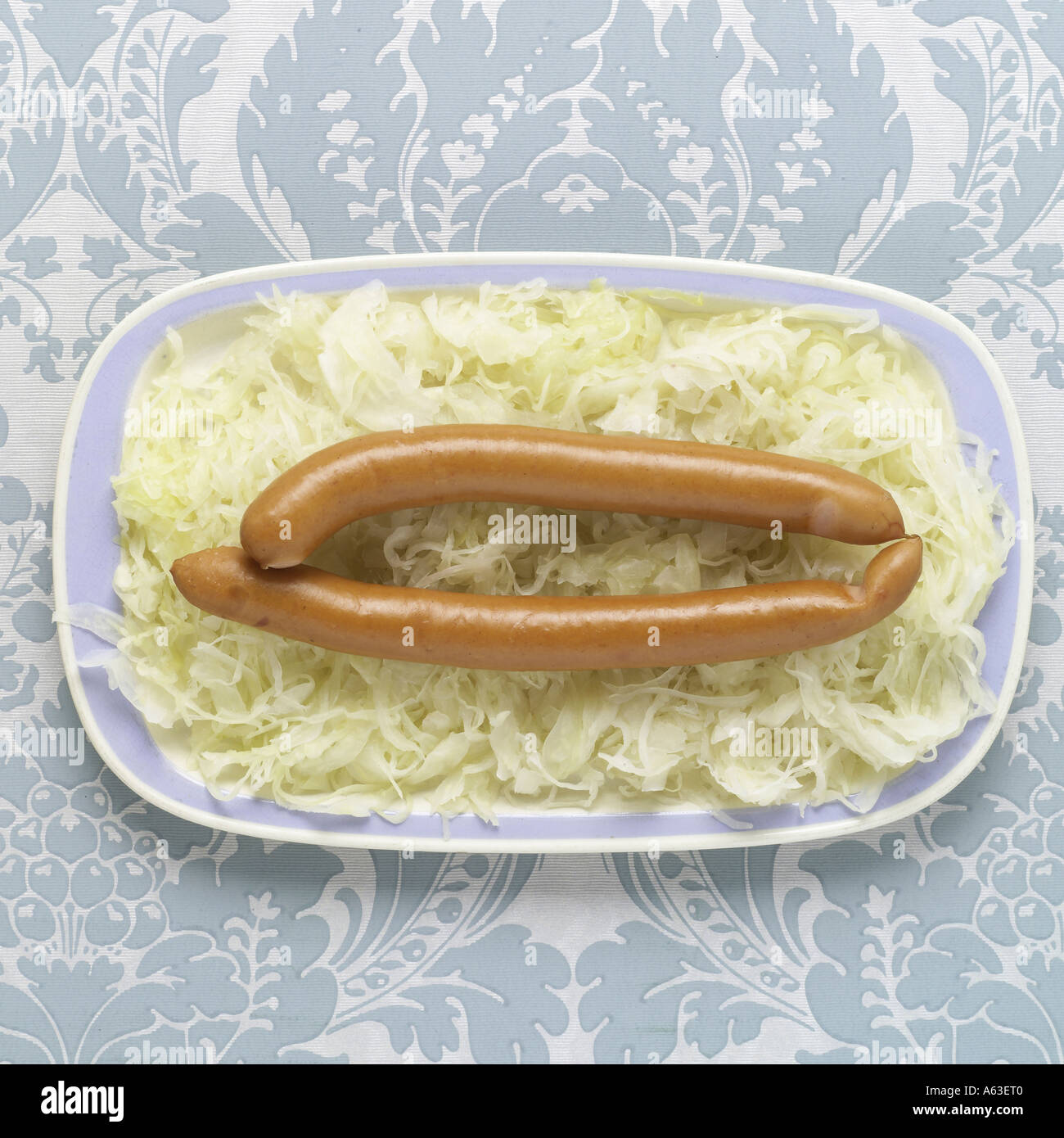 High angle view of sausages and cabbage on plate Stock Photo