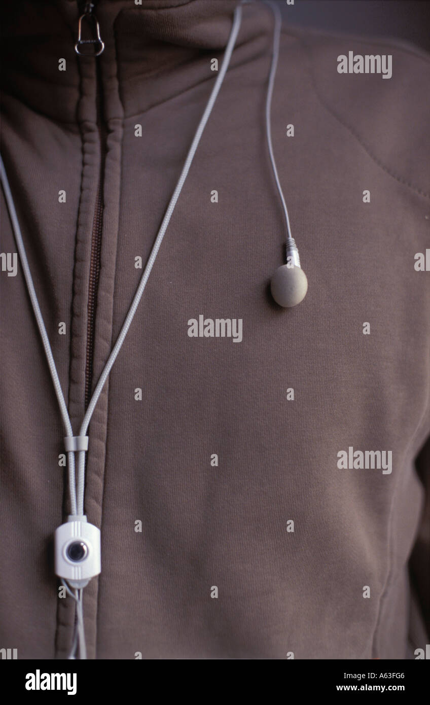 Close-up of earphones on pullover shirt Stock Photo