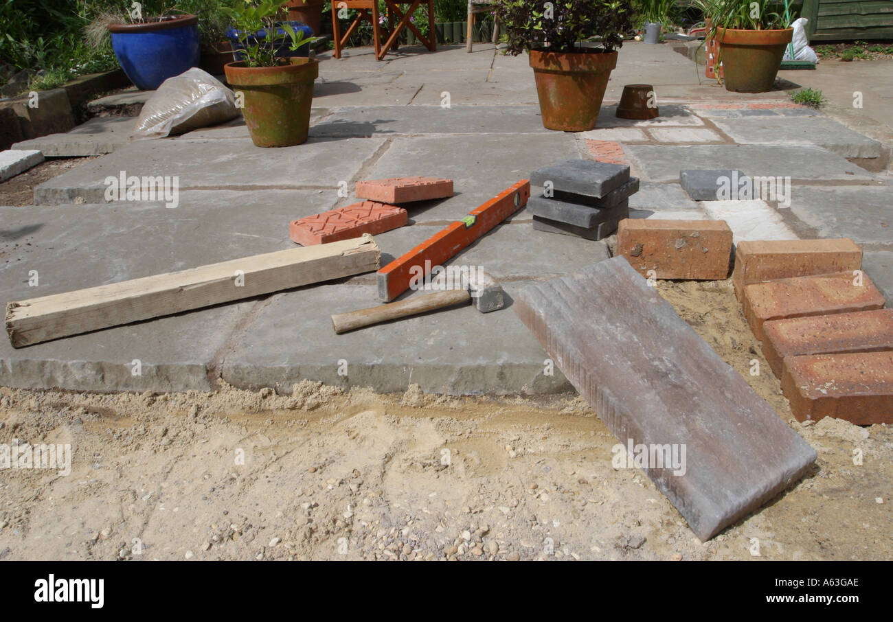 Building a garden patio tools and slabs Stock Photo Alamy