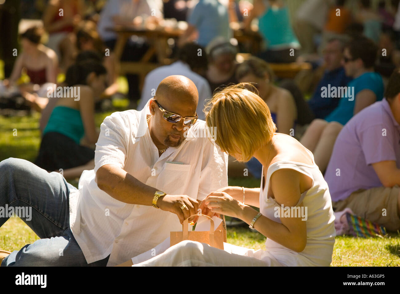 Couple enjoying the sunshine. Regent's Park, London. Stock Photo