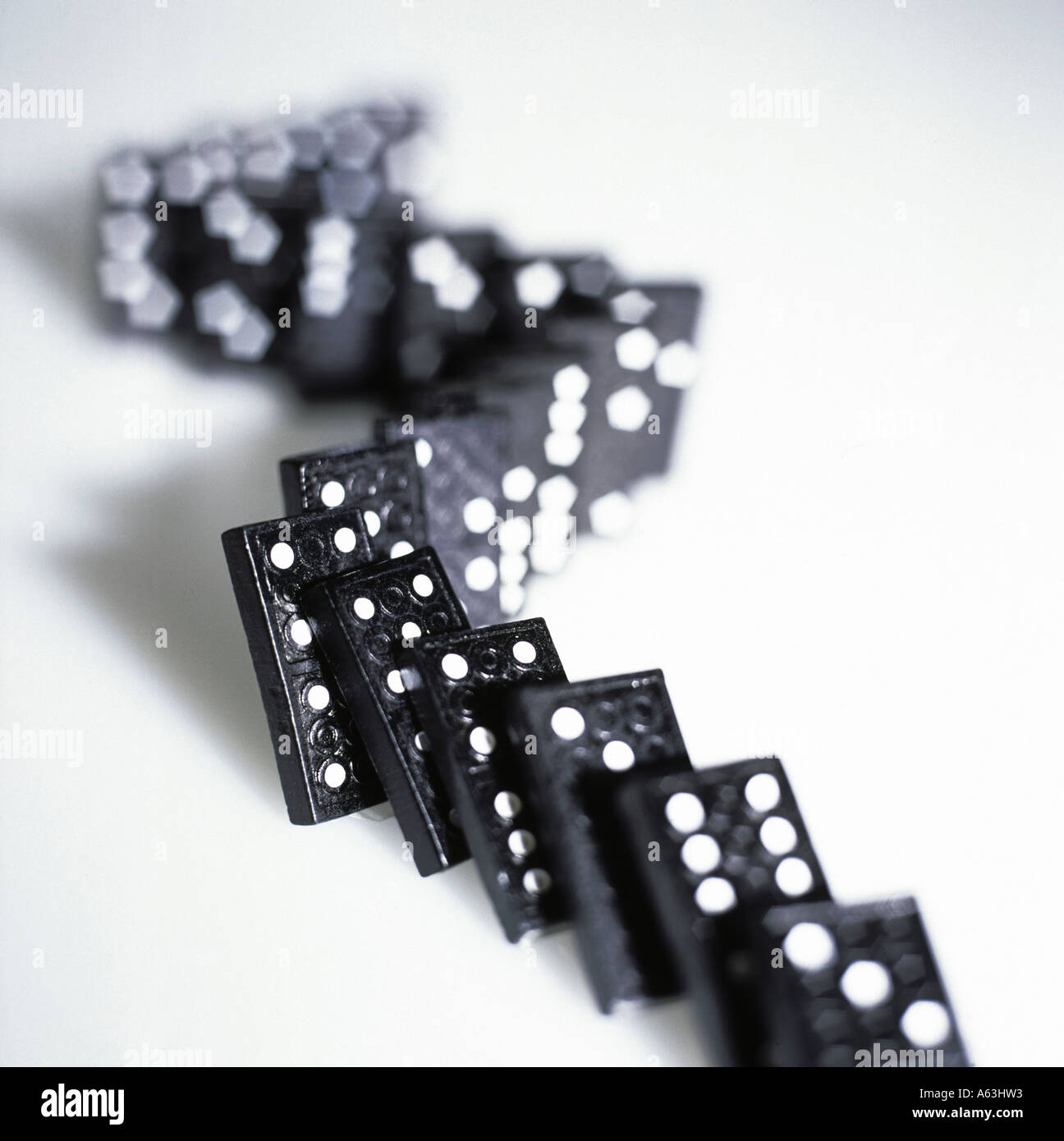 Close-up of falling row of dominoes Stock Photo - Alamy
