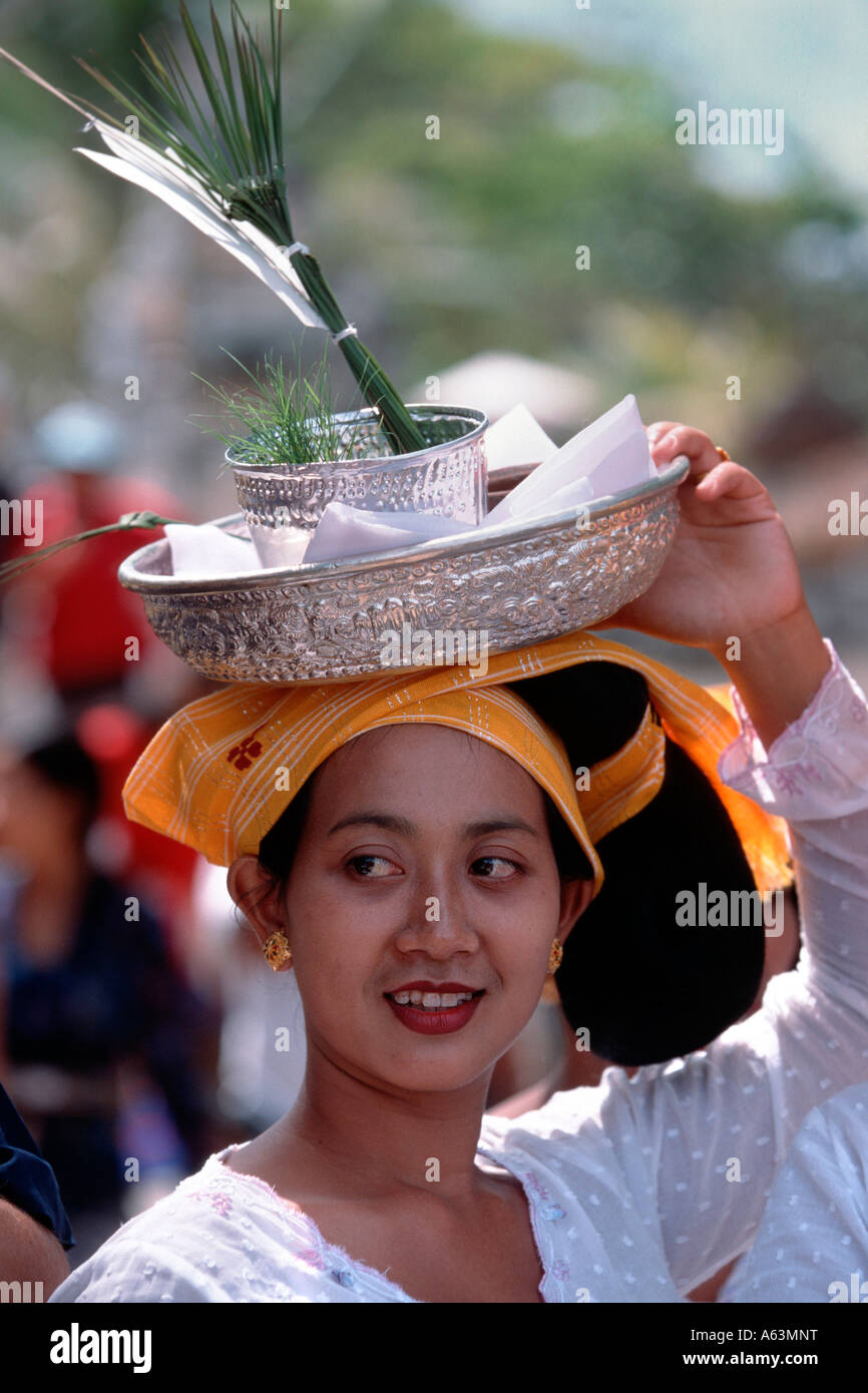 Bali, Indonesia - woman with offerings during ritual cremation of high ...