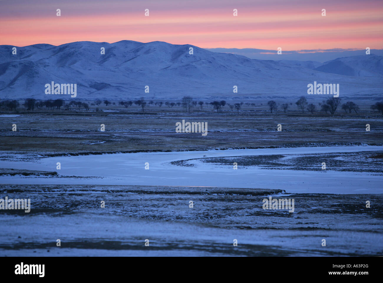 Mongolia - Evening mood over frozen river Stock Photo