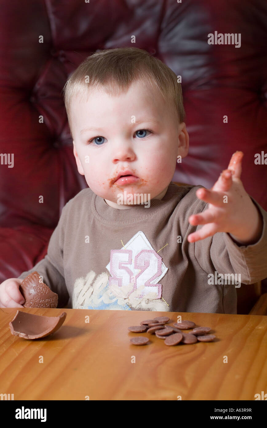 2 year old boy eating at home Stock Photo
