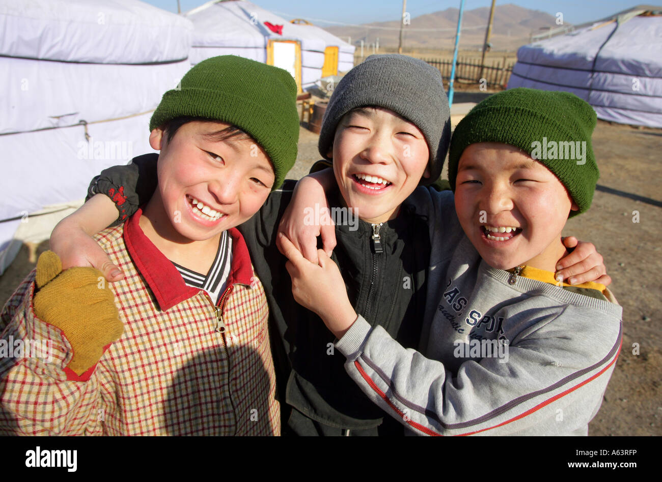 Mongolia - nomad children in front of a traditional ger in the stepps ...