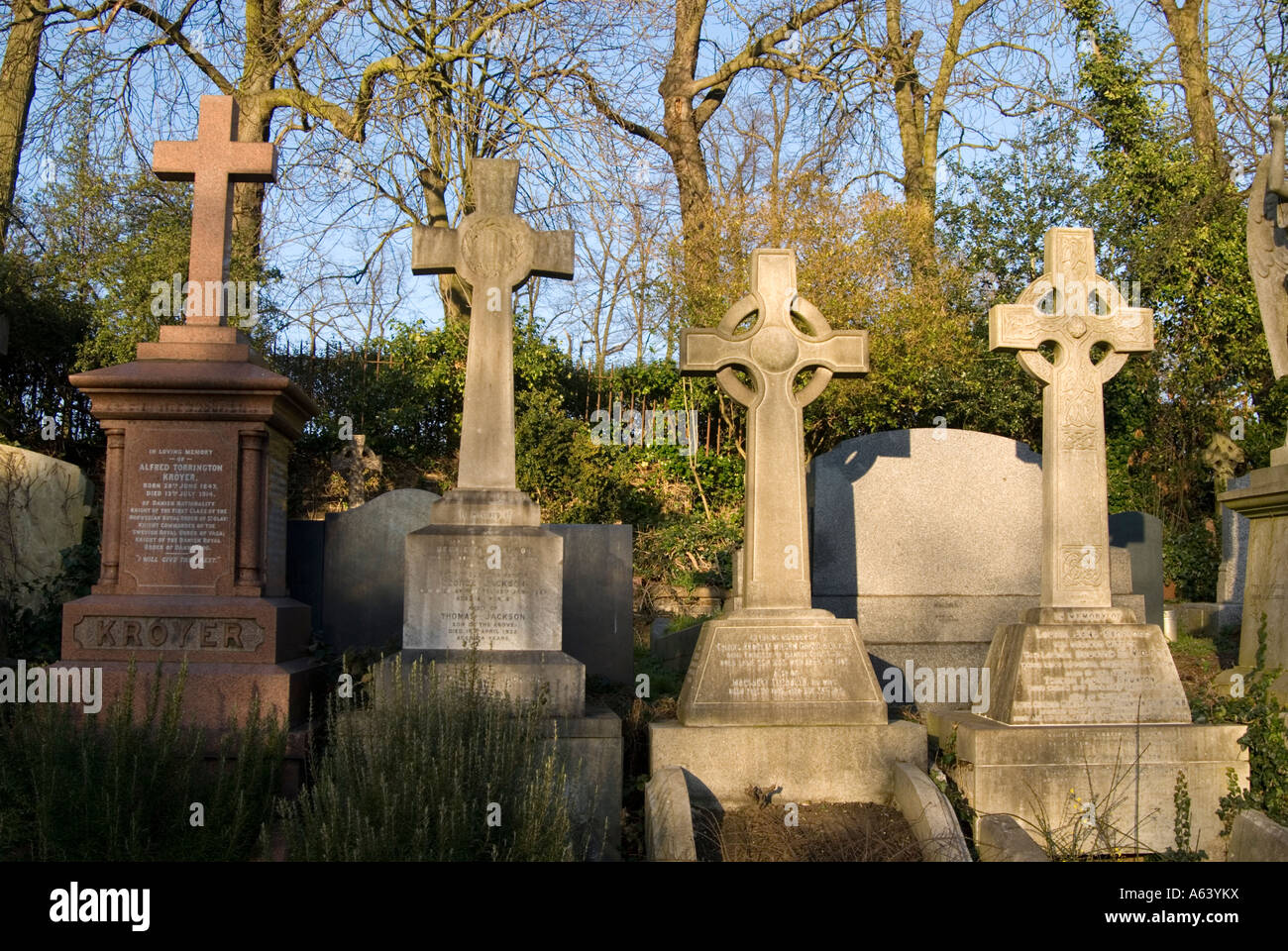 Crucifix gravestones at Highgate Cemetery London England UK Stock Photo