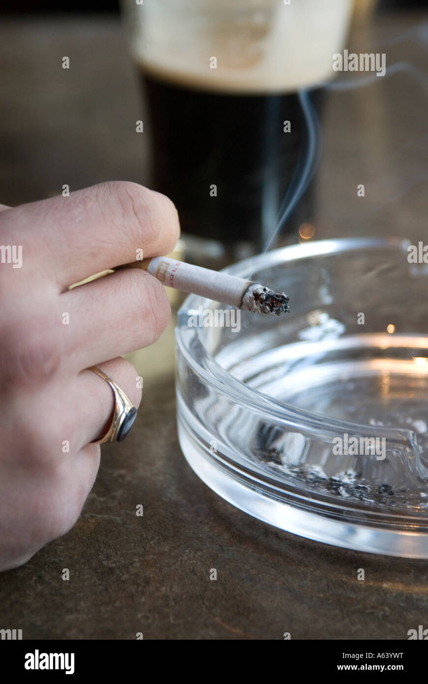 Smoking cigarette in pub Stock Photo