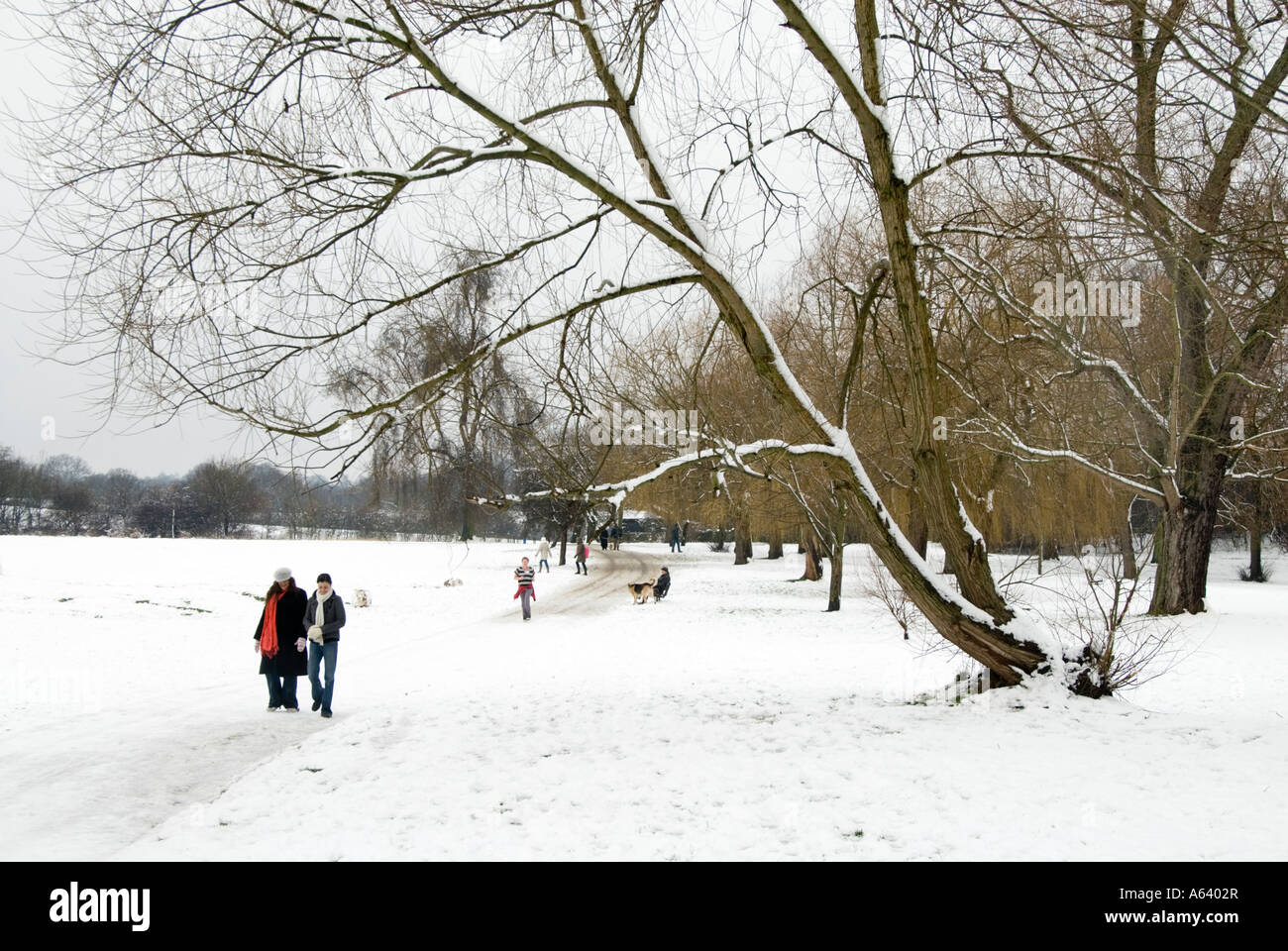 People walking on snow covered Hampstead Heath London England UK Stock Photo
