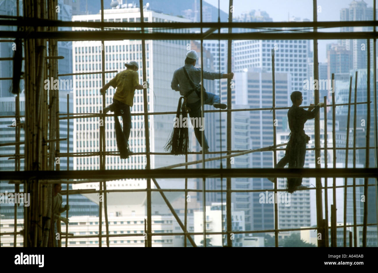 Workers on scaffolding outside the Hong Kong Exhibition Centre Stock Photo