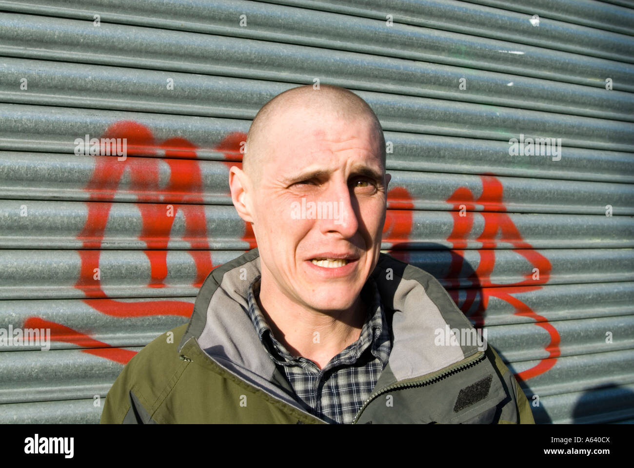 Skinhead man with worried and frightened expression London England UK Stock Photo