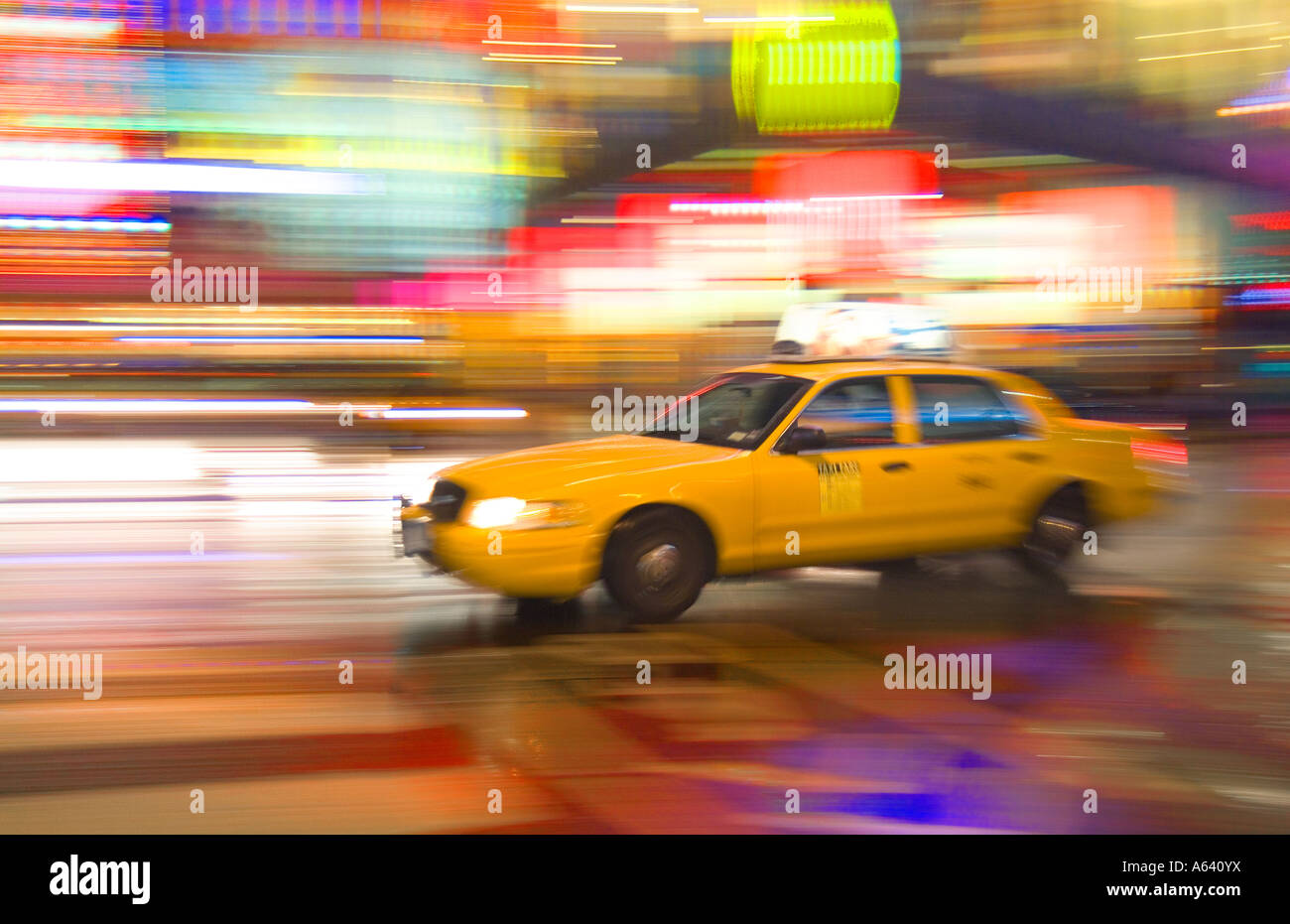 Taxi Cab, New York City At Night With Motion Blur And Bright Lights, Times Square, New York City, USA Stock Photo