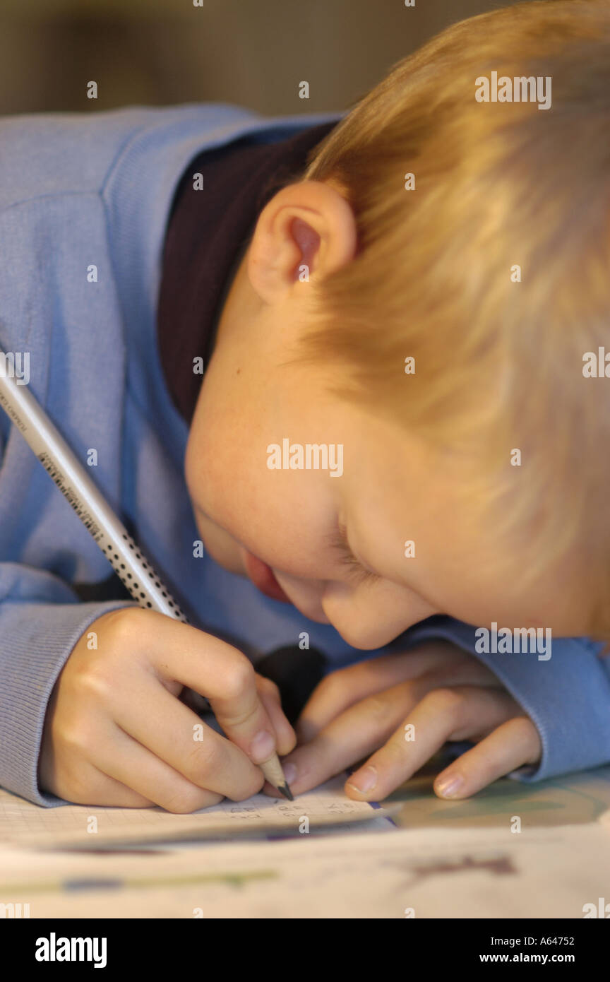 Little boy doing his homework Stock Photo