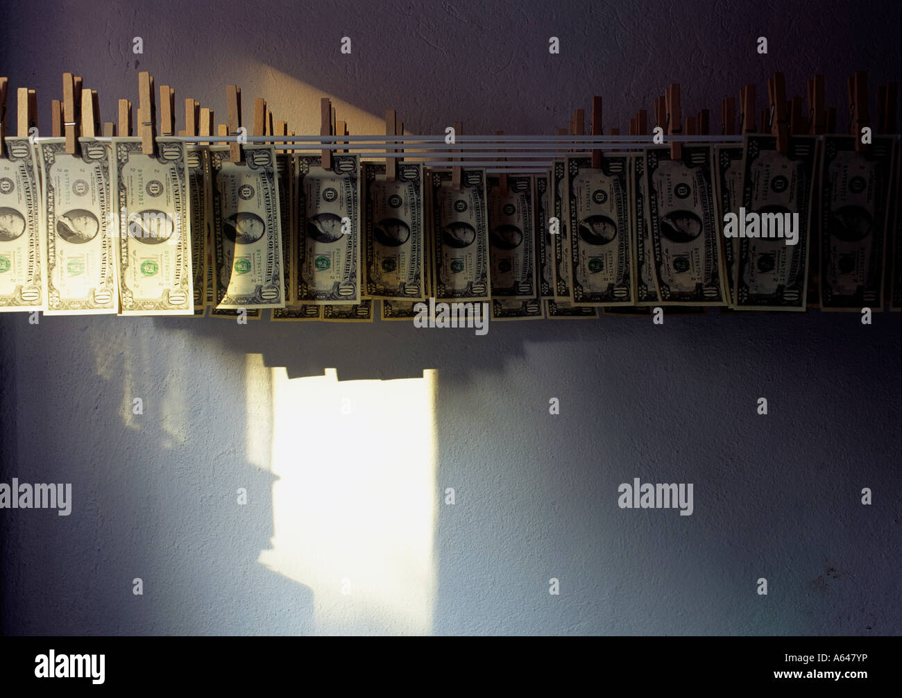 symbolism for money washing or copying of dollar bills editorial use only Stock Photo