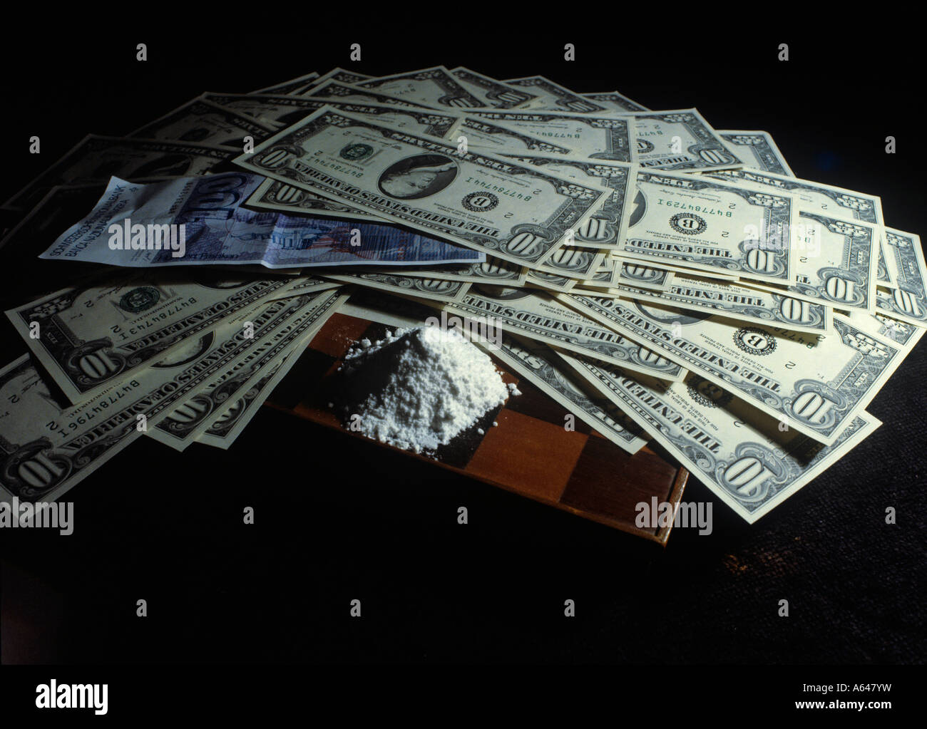 dollar bills and cocaine or heroine editorial use only Stock Photo
