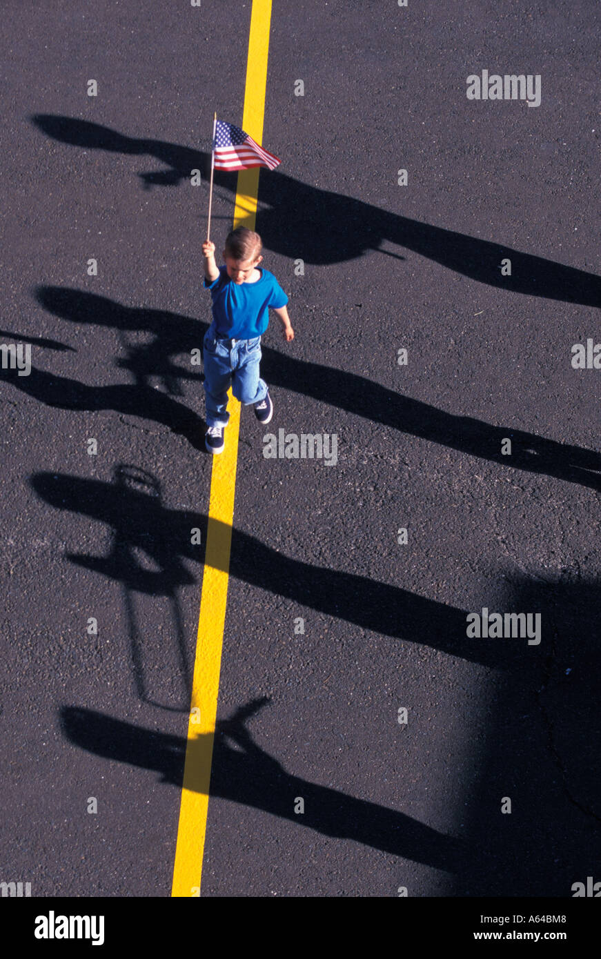 Shadow of Youth Marching Band and Little Boy with American Flag Stock