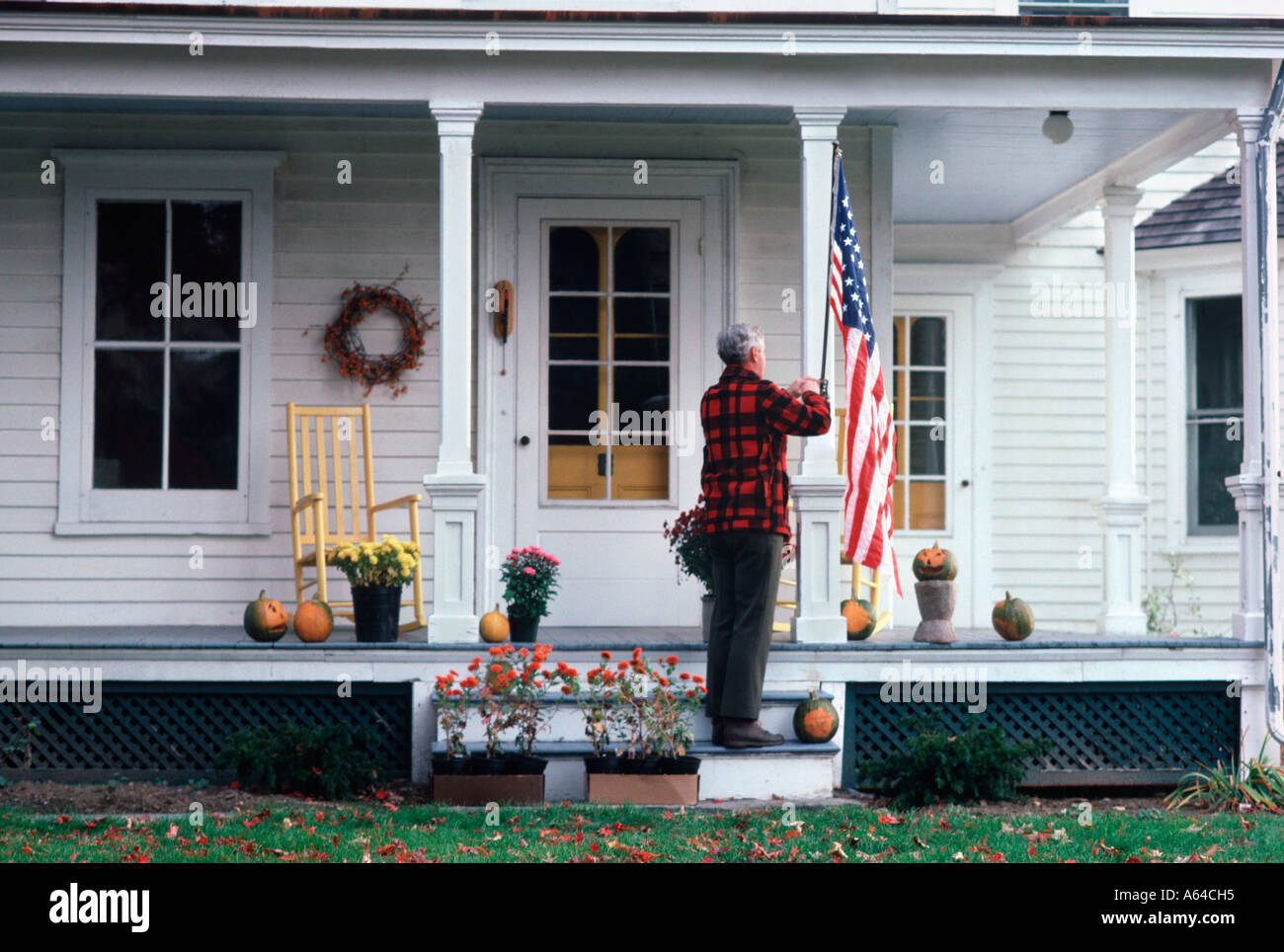 American flag hanging porch hi-res stock photography and images - Alamy