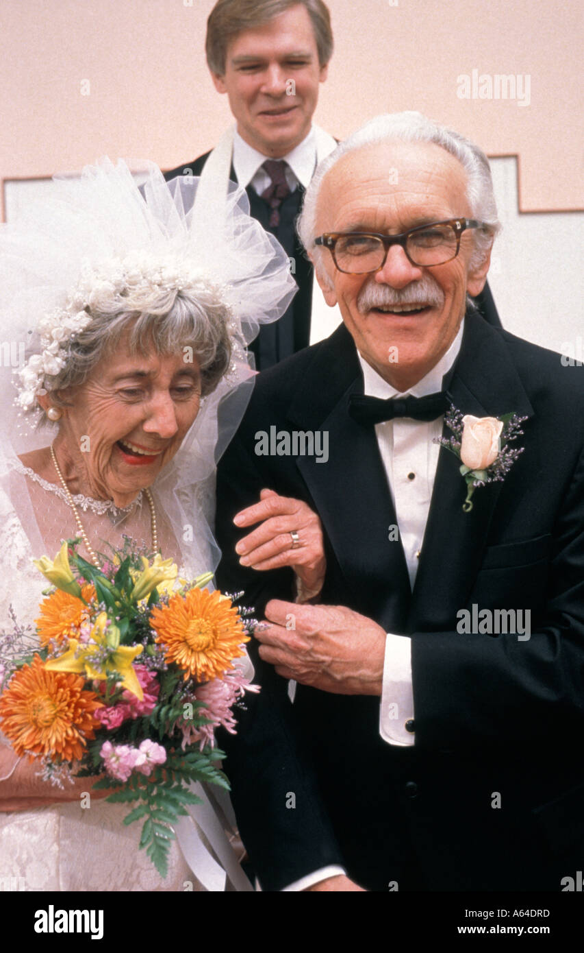 Elderly bride and groom leaving church Stock Photo Alamy