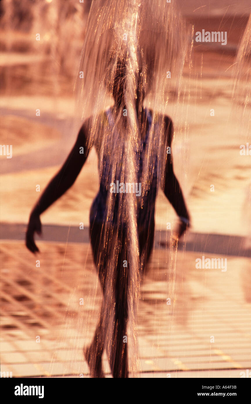 young girl playing in fountain Stock Photo - Alamy