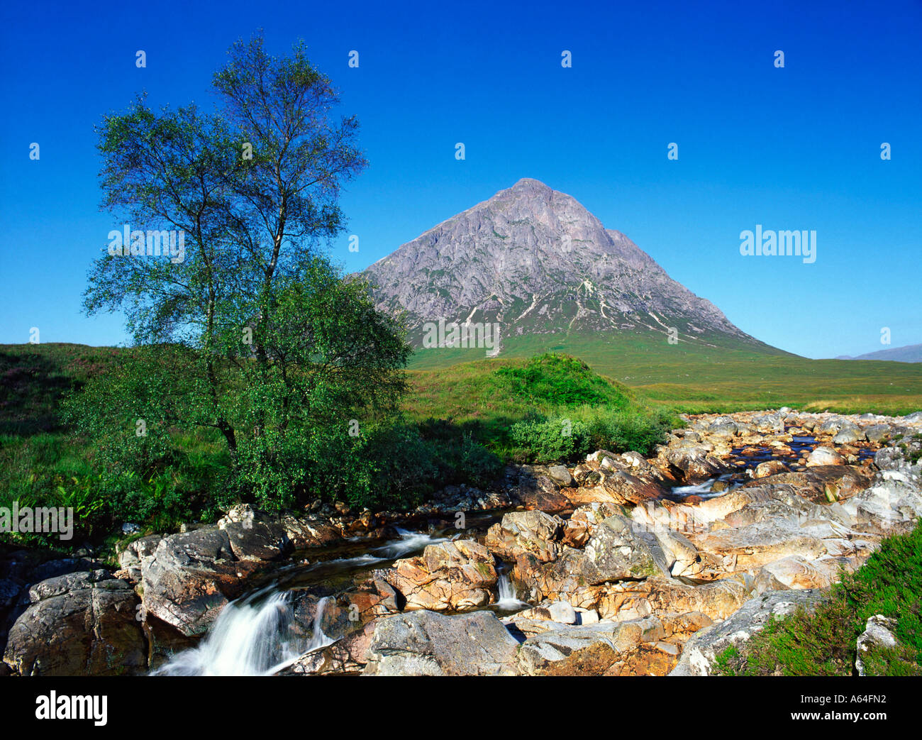 waterfall with view to Buachaille Etive Mor in Glencoe Scotland Stock Photo