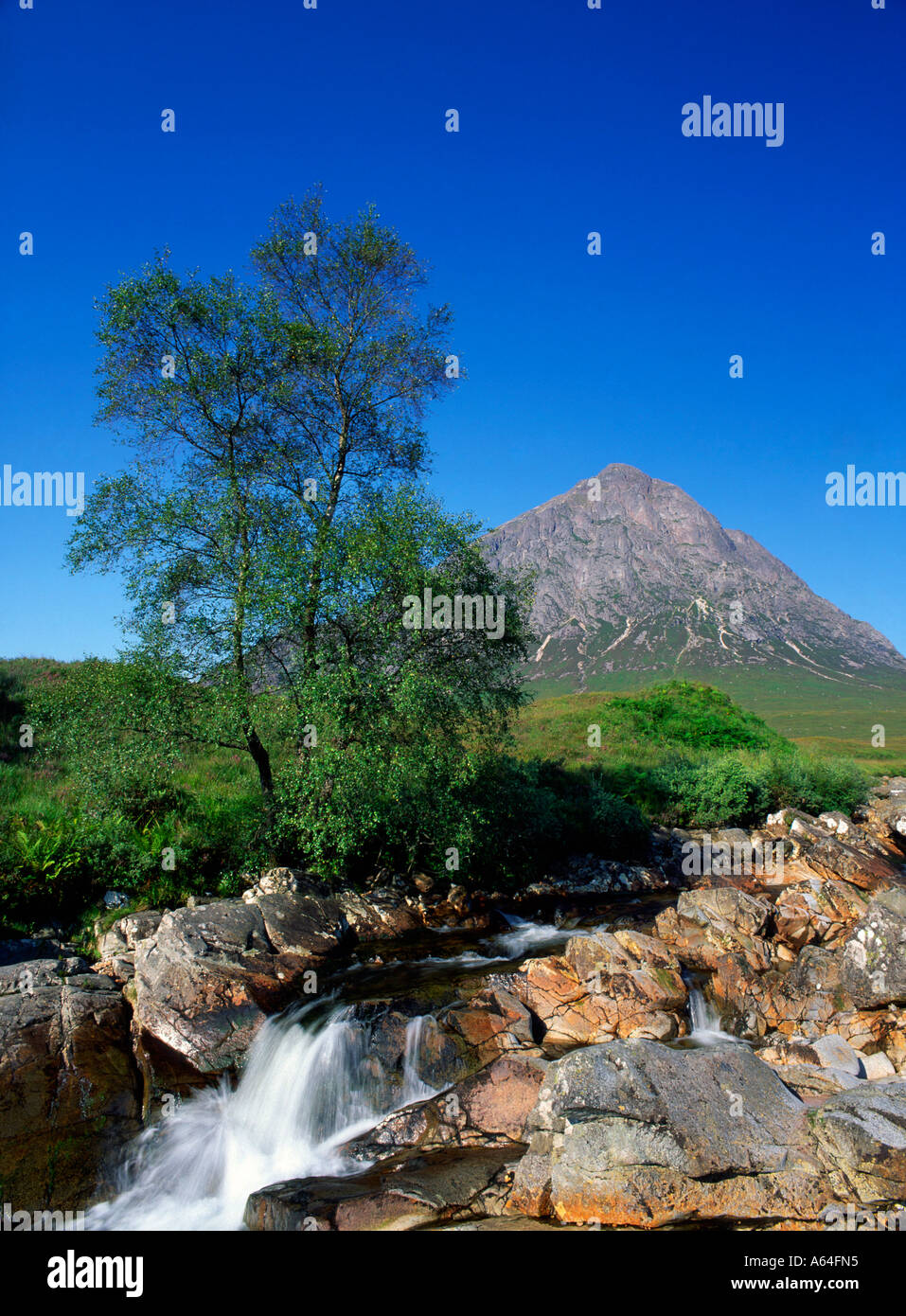 waterfall with view to Buachaille Etive Mor in Glencoe Scotland Stock Photo