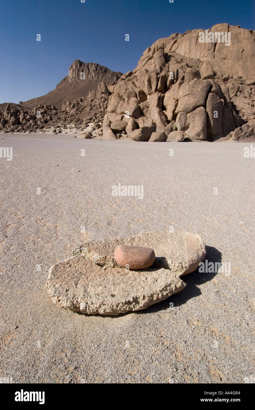 Old grinding stone for grain at Jebel Uweinat, Jabal al Awaynat Stock Photo