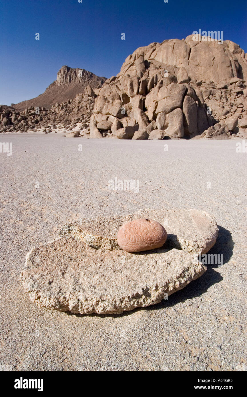 Old grinding stone for grain at Jebel Uweinat, Jabal al Awaynat Stock Photo