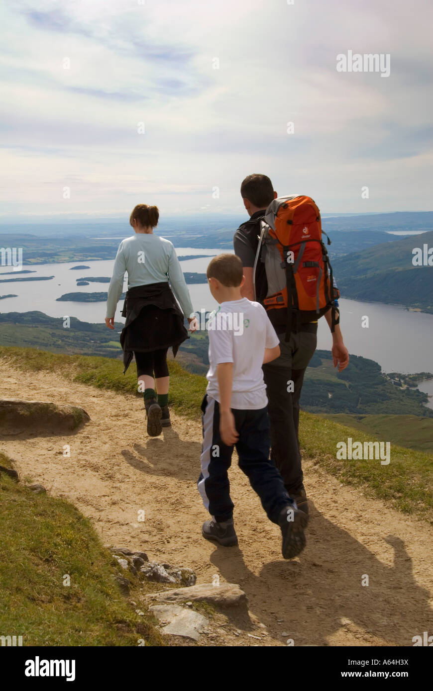 A family hillwalking along the summit ridge of Ben Lomond,Scotland Stock Photo