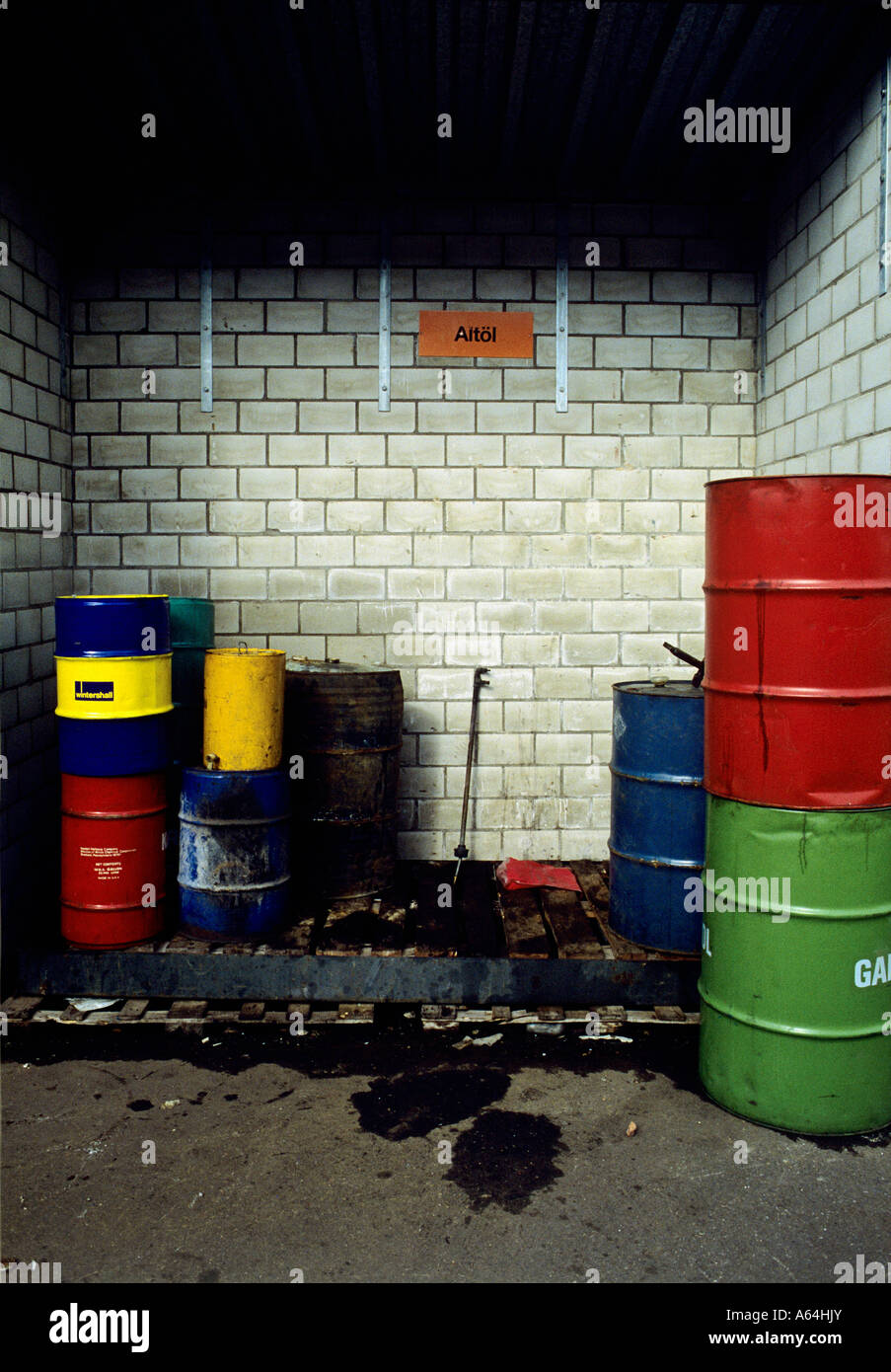 barrels with used oil and edible deep fry oil at collecting point Stock Photo