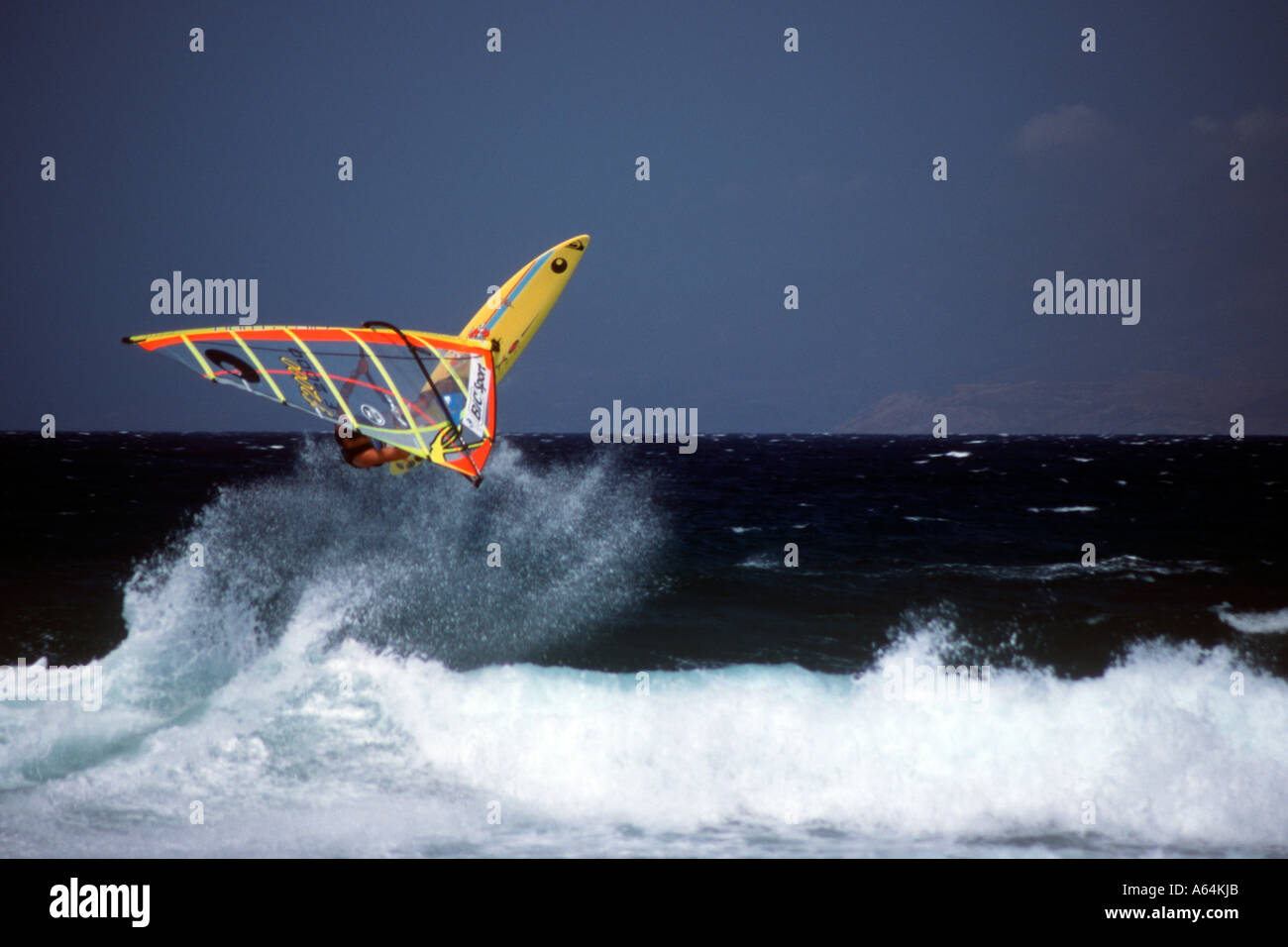 Robert Teriitehau windsurfing on Tsoukalia beach launches himself off a  breaking wave Paros Cyclades Islands Greece Stock Photo - Alamy