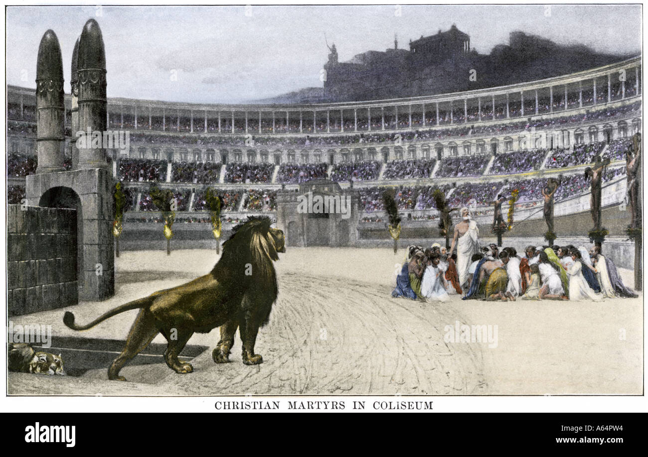 Christian martyrs facing hungry lions in the Colosseum in ancient Rome. Hand-colored halftone of an illustration Stock Photo