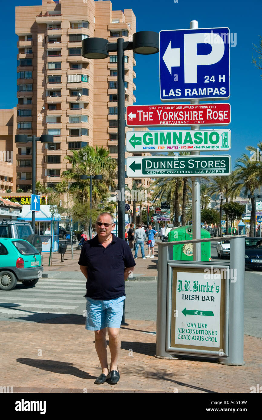 Tourists walking on Paseo Maritimo Rey de Espana in Fuengirola Spain Stock  Photo - Alamy