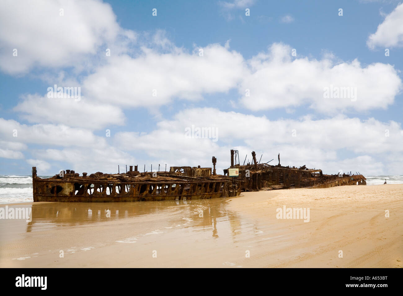 The rusting hulk of the Maheno on Seventy five Mile Beach The former cruise liner was washed up onto Fraser Island's east coast Stock Photo