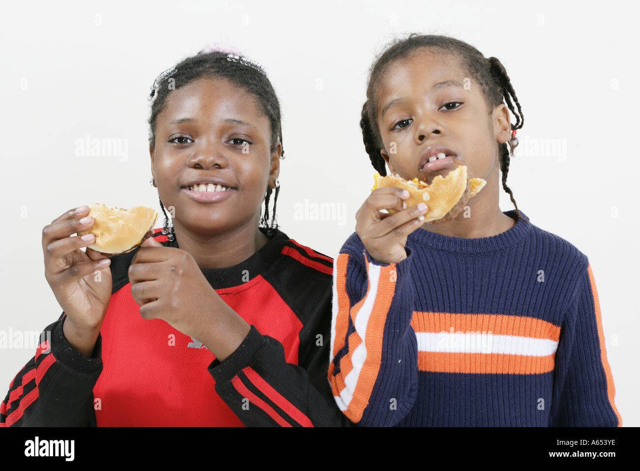 Overweight family eating junk food hires stock photography and images